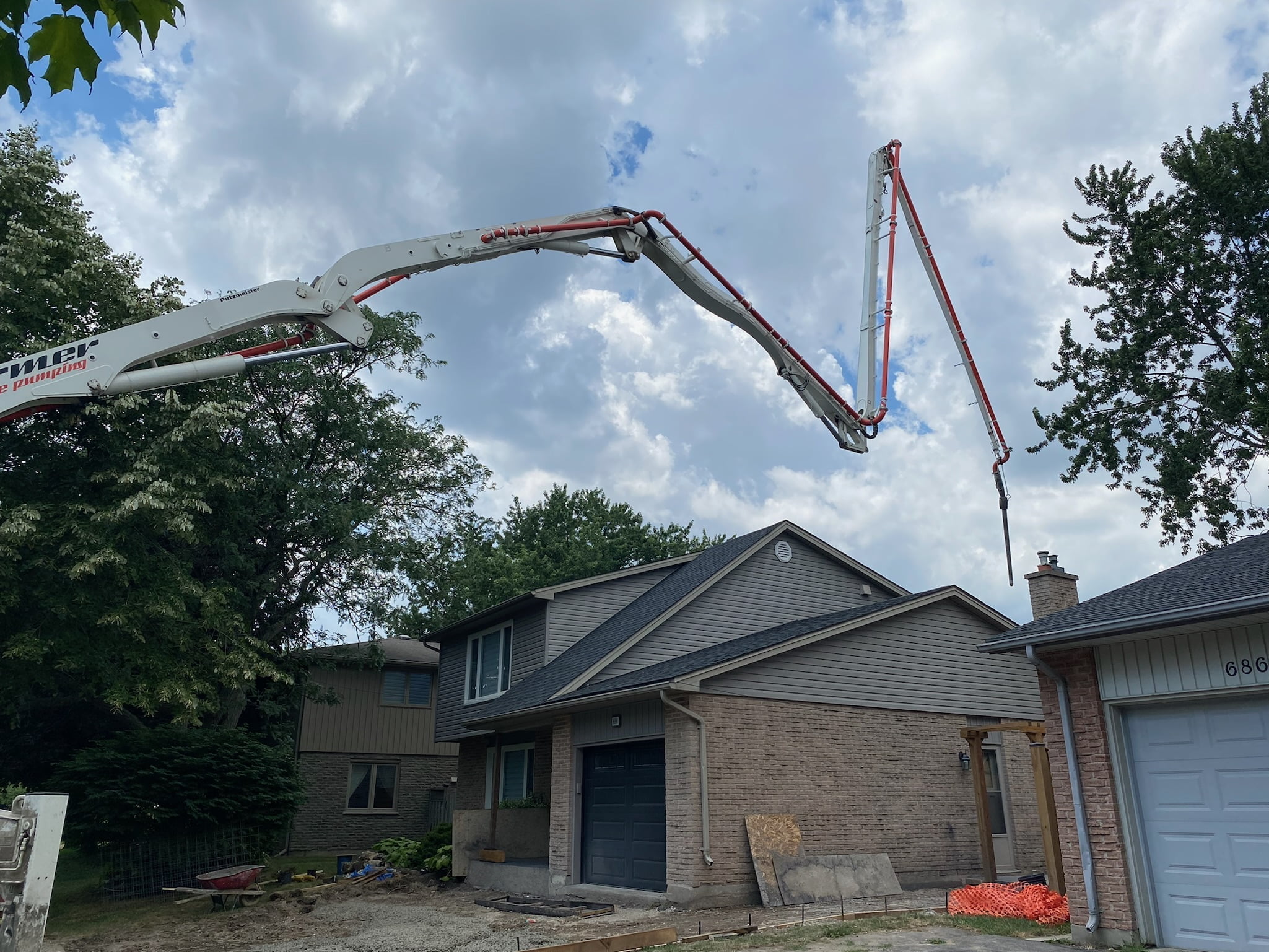 02-10 Barclay concrete delivery to backyard over house