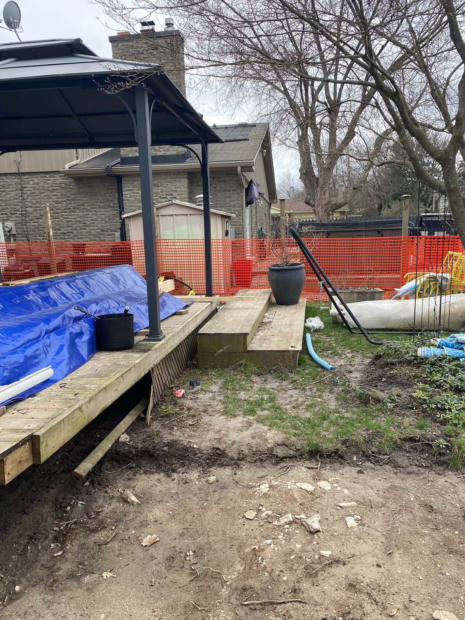 old wooden deck and steps down to backyard
