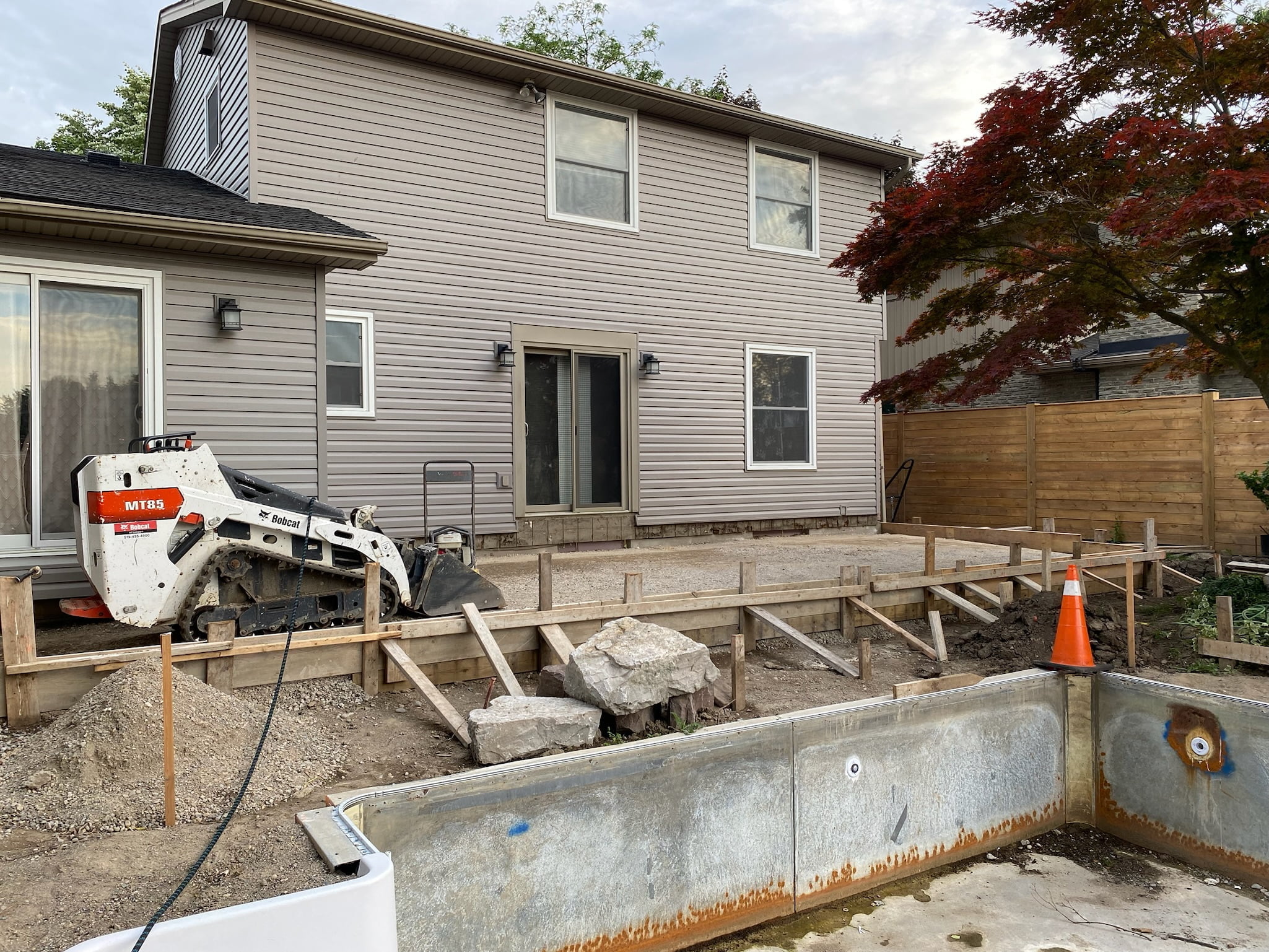 equipment prepping surfaces for new concrete paito and pool deck