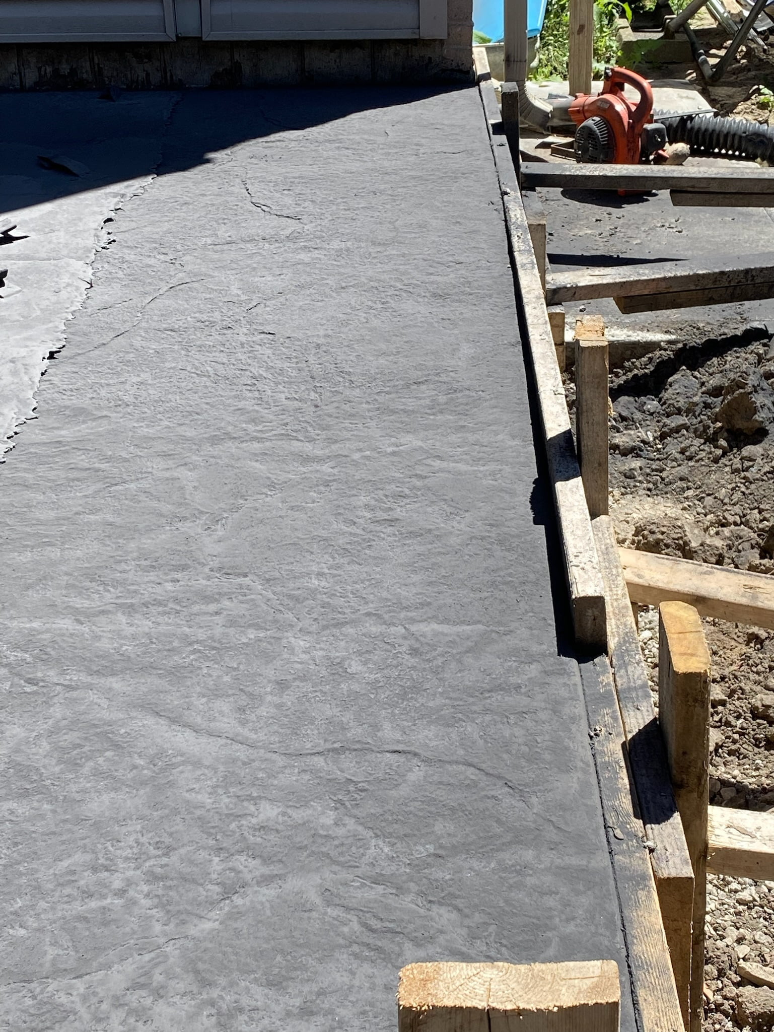 freshly stamped custom concrete patio