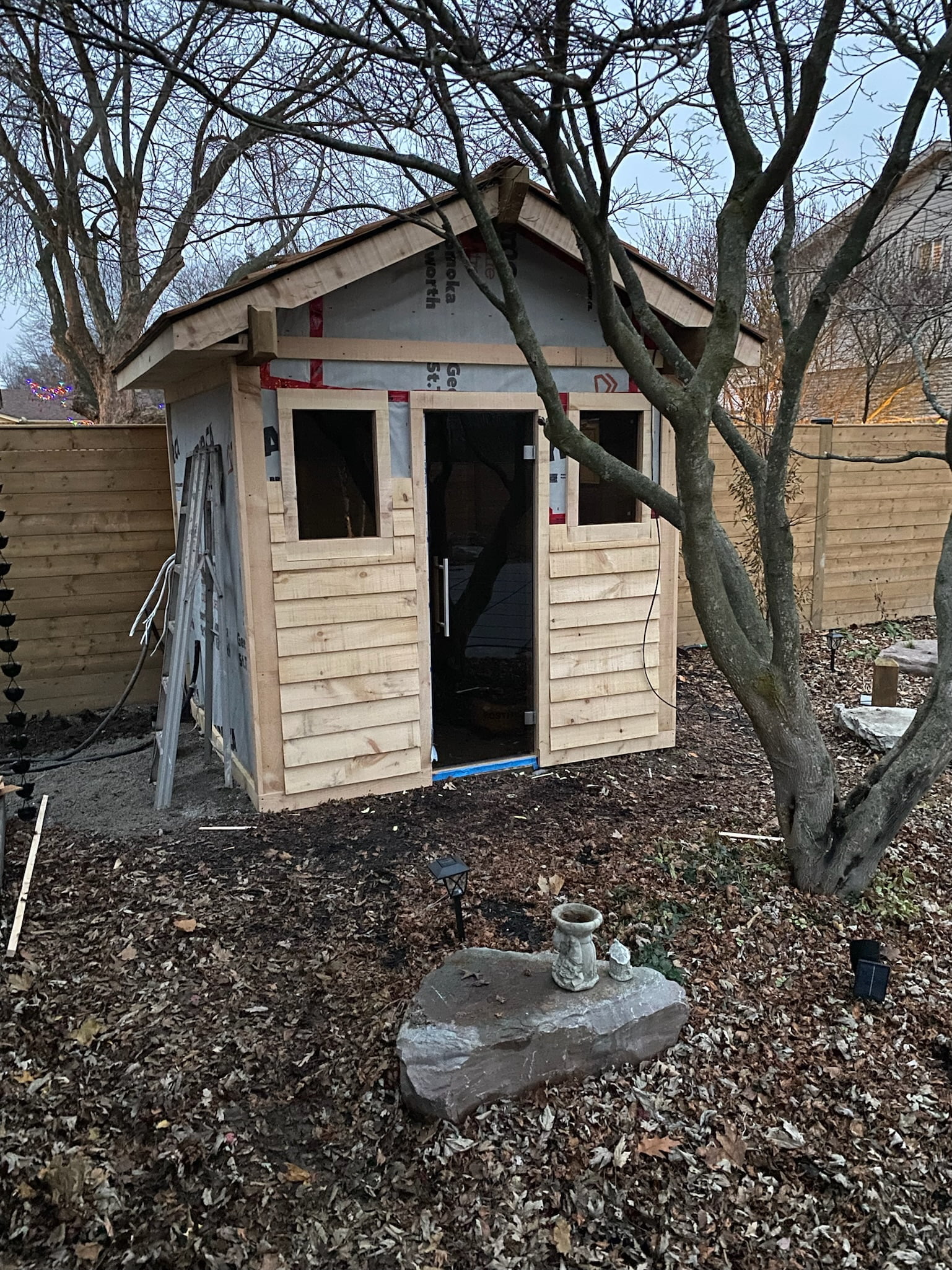 custom wooden pool shed exterior in progress