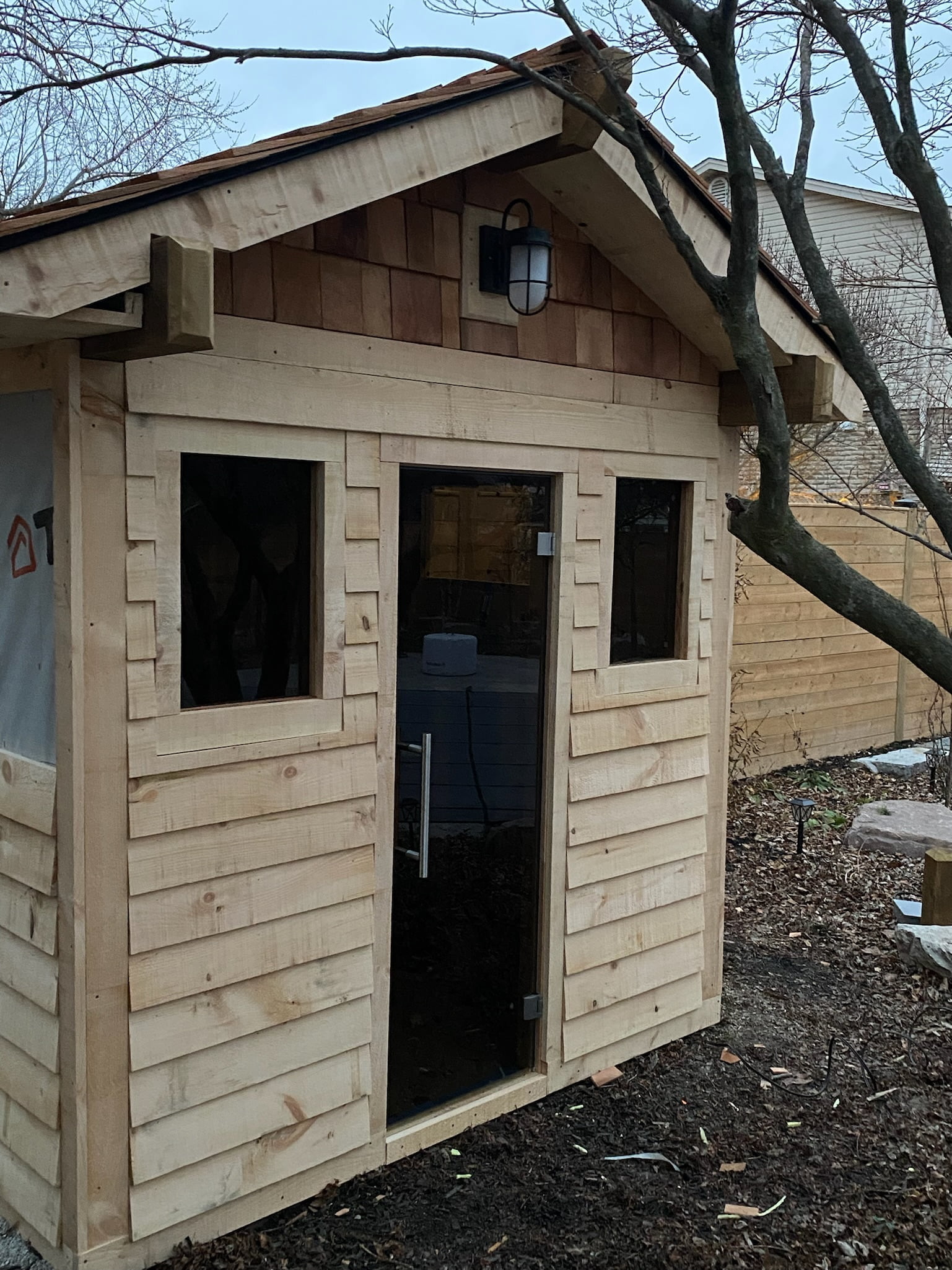 Exterior of custom wooden pool shed