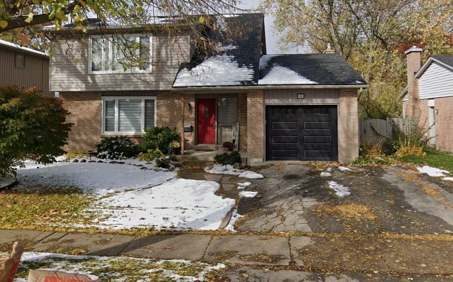 before image of home with old asphalt driveway