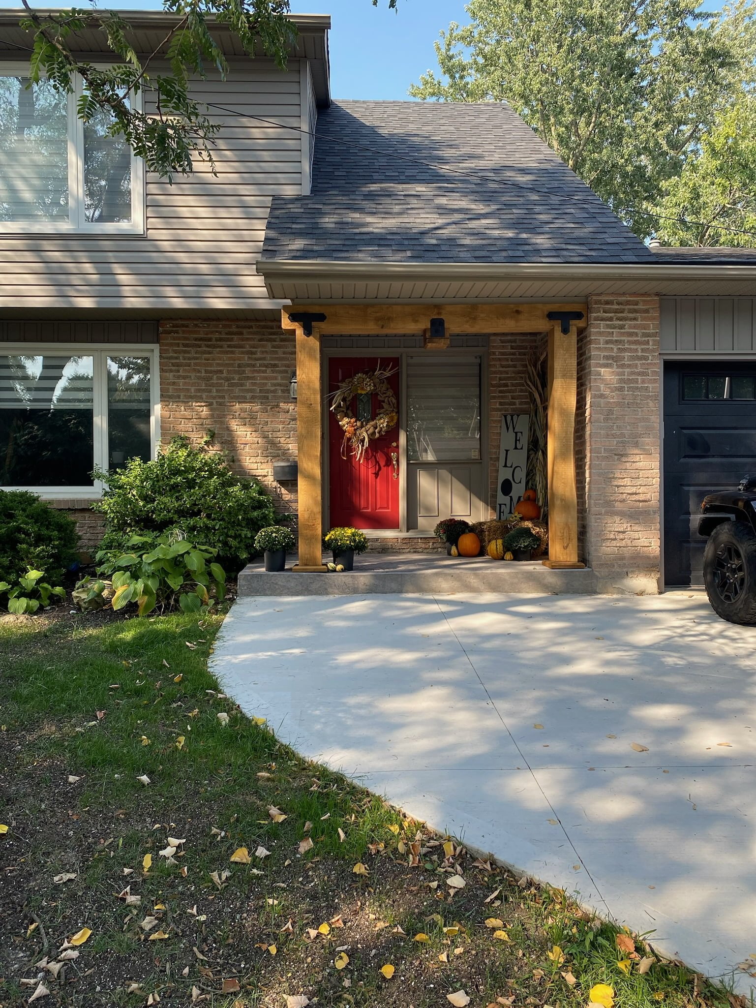 Front porch with new wooden arch and concrete