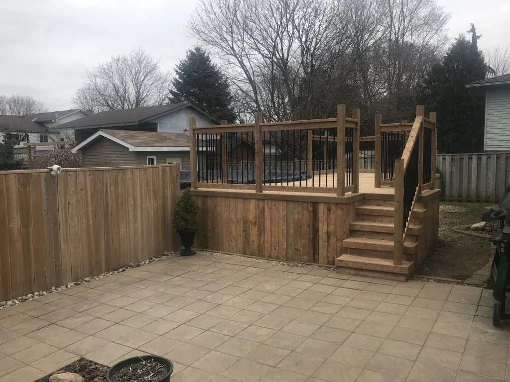 raised wooden deck around above ground pool