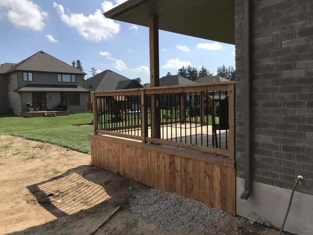 small covered deck on back of condo