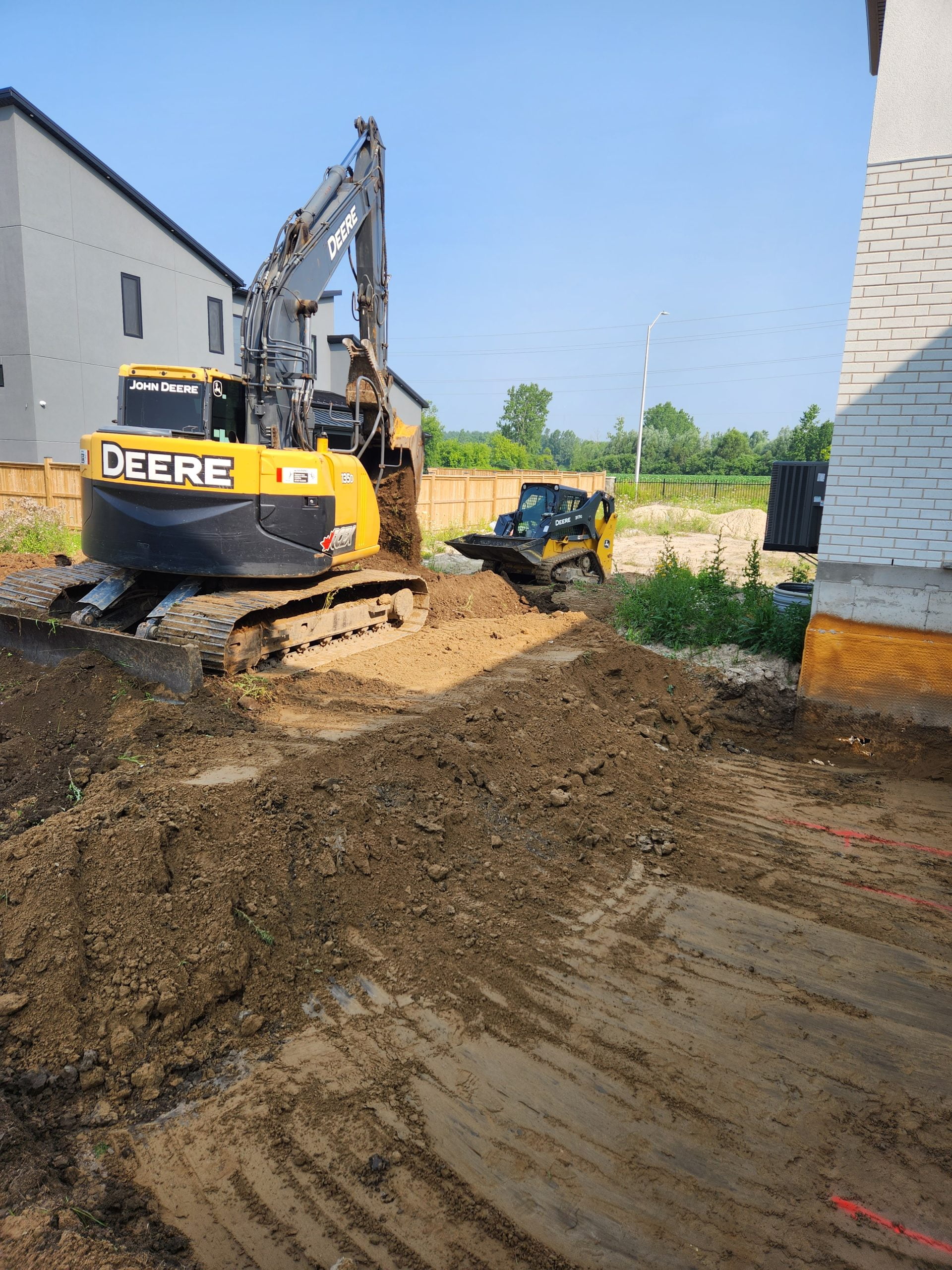 Excavation equipment preparing site for new pool installation