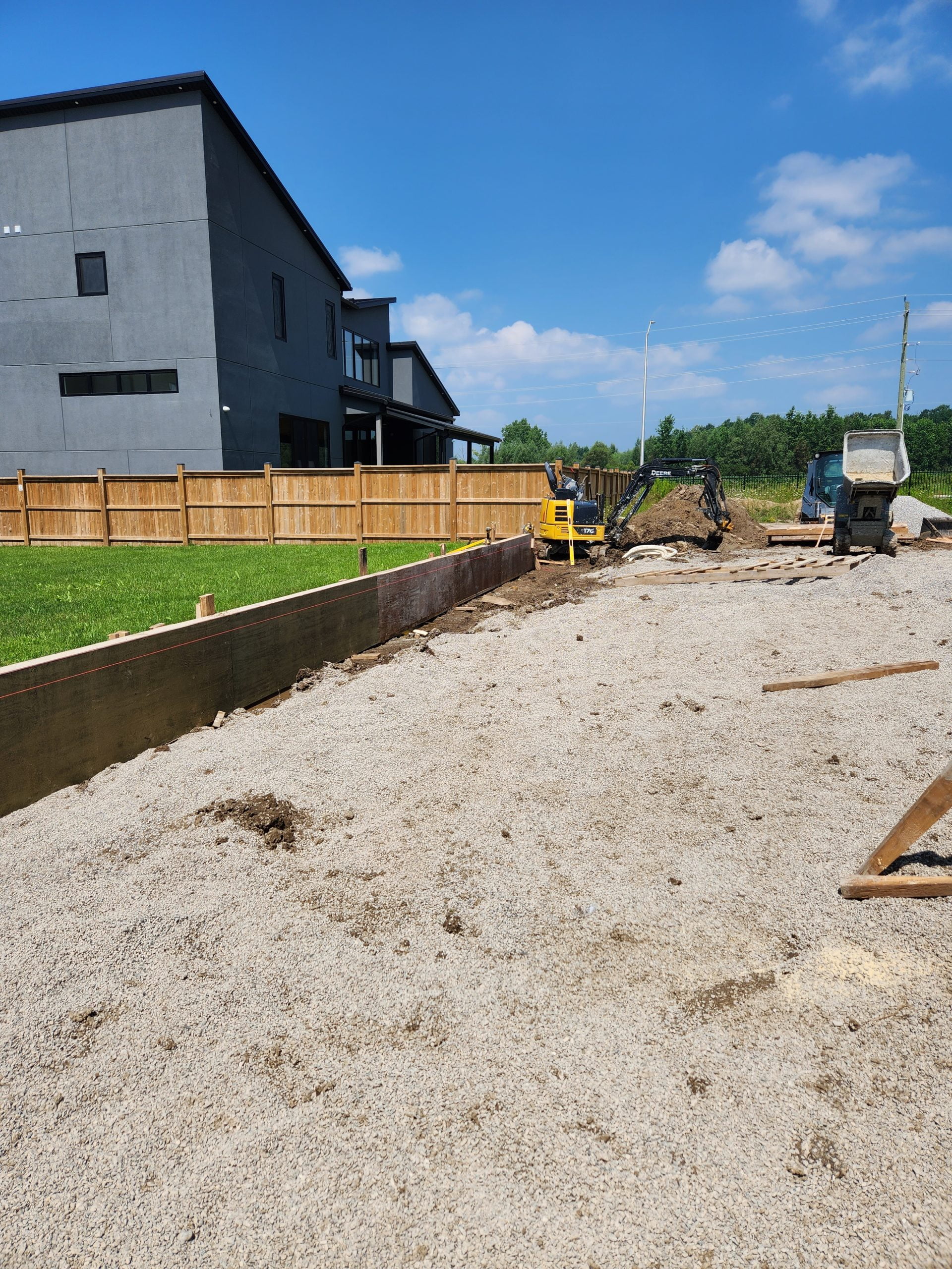 levelling crushed gravel for new concrete pool deck and patio