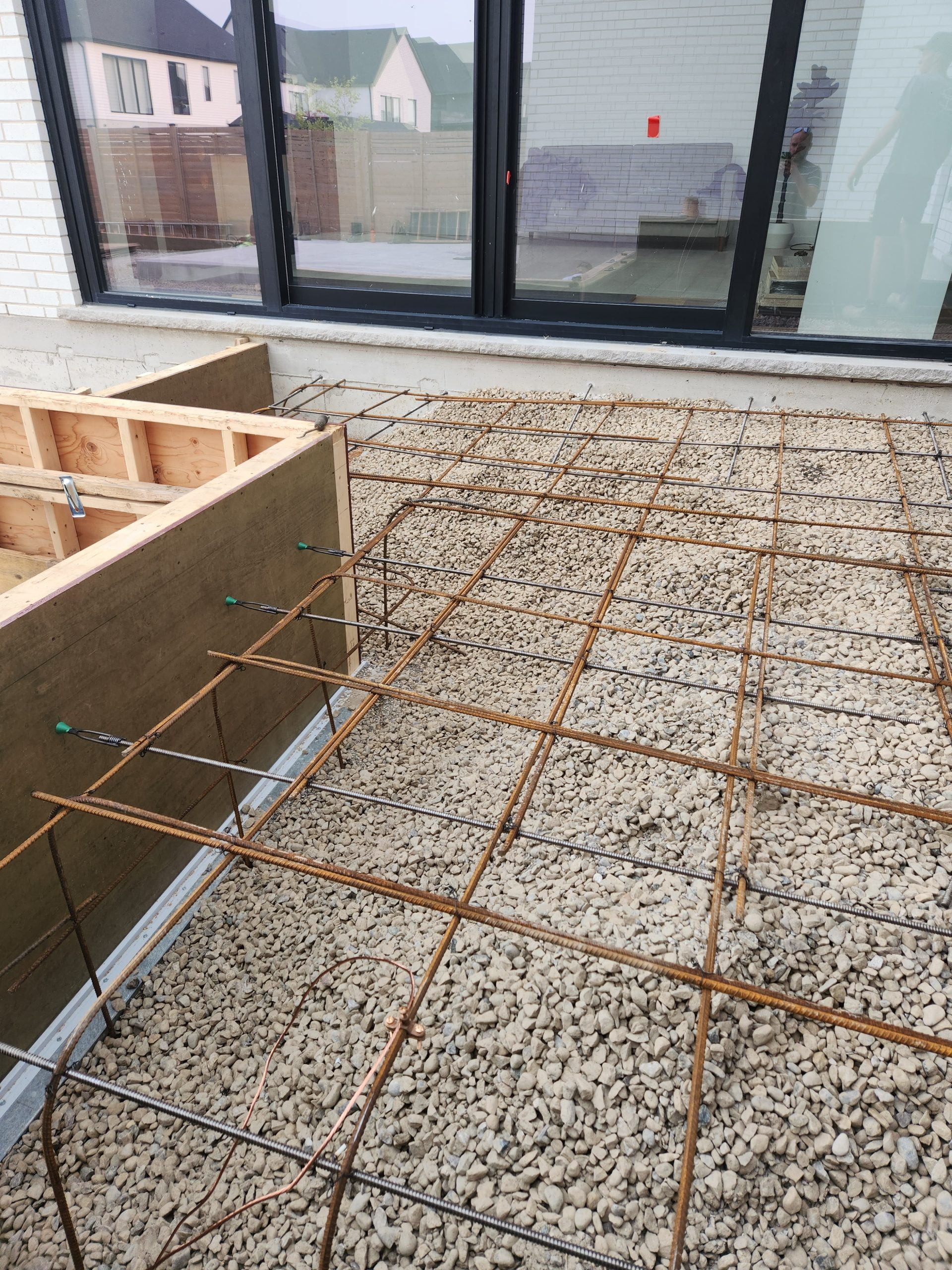 rebar and bonding of raised concrete patio in front of sliding glass doors