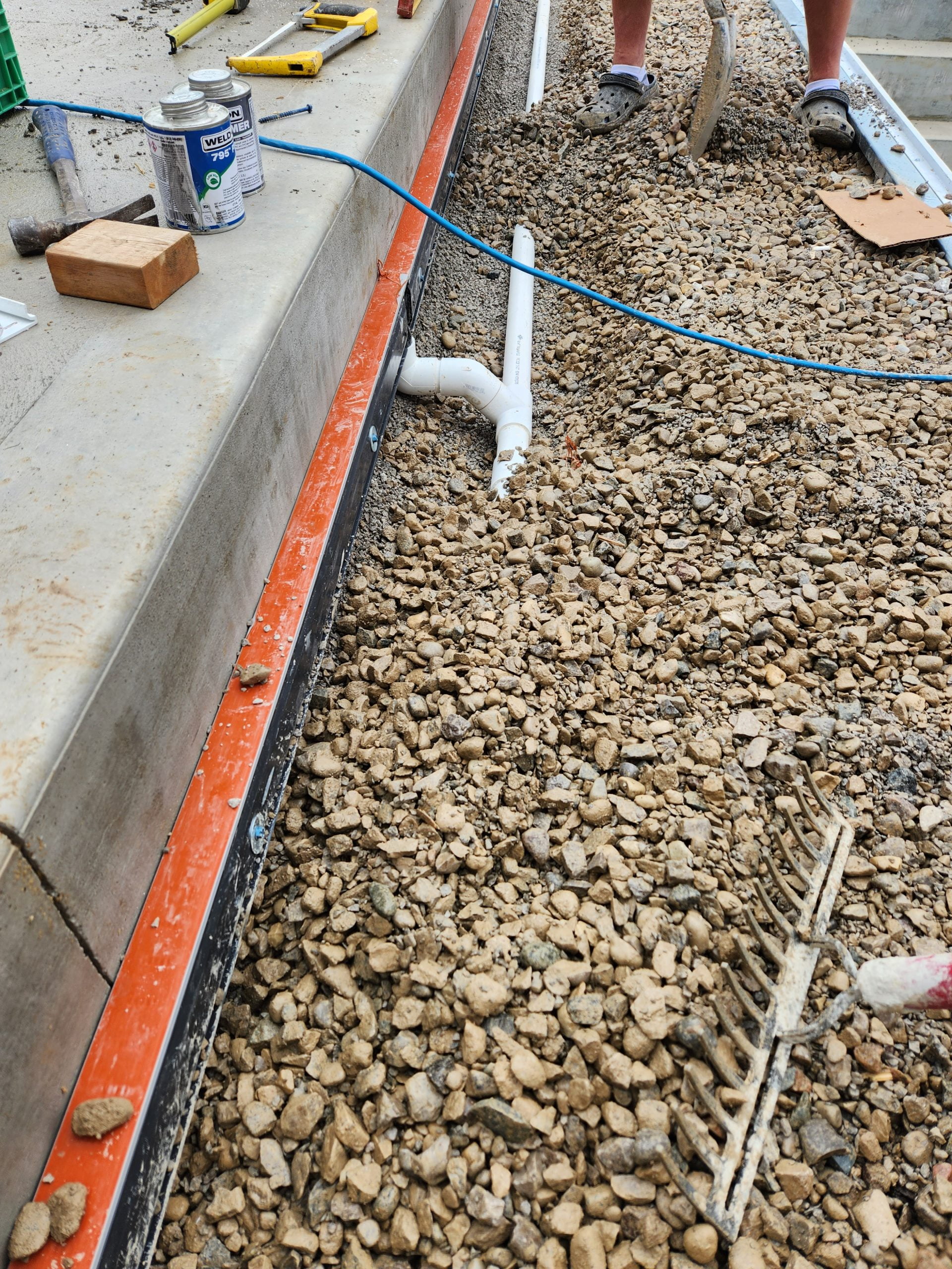 adding strip drain to move water away from house during pool and patio installation