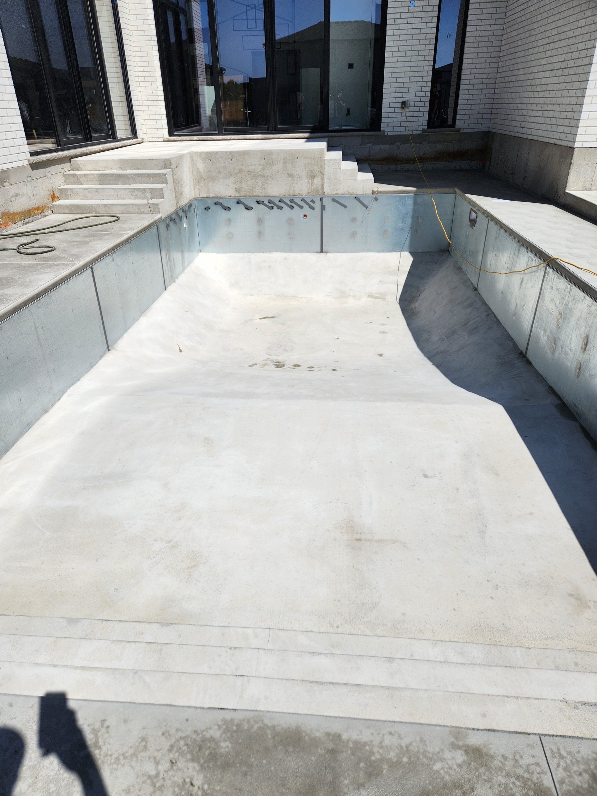 finished concrete phase of custom pool installation