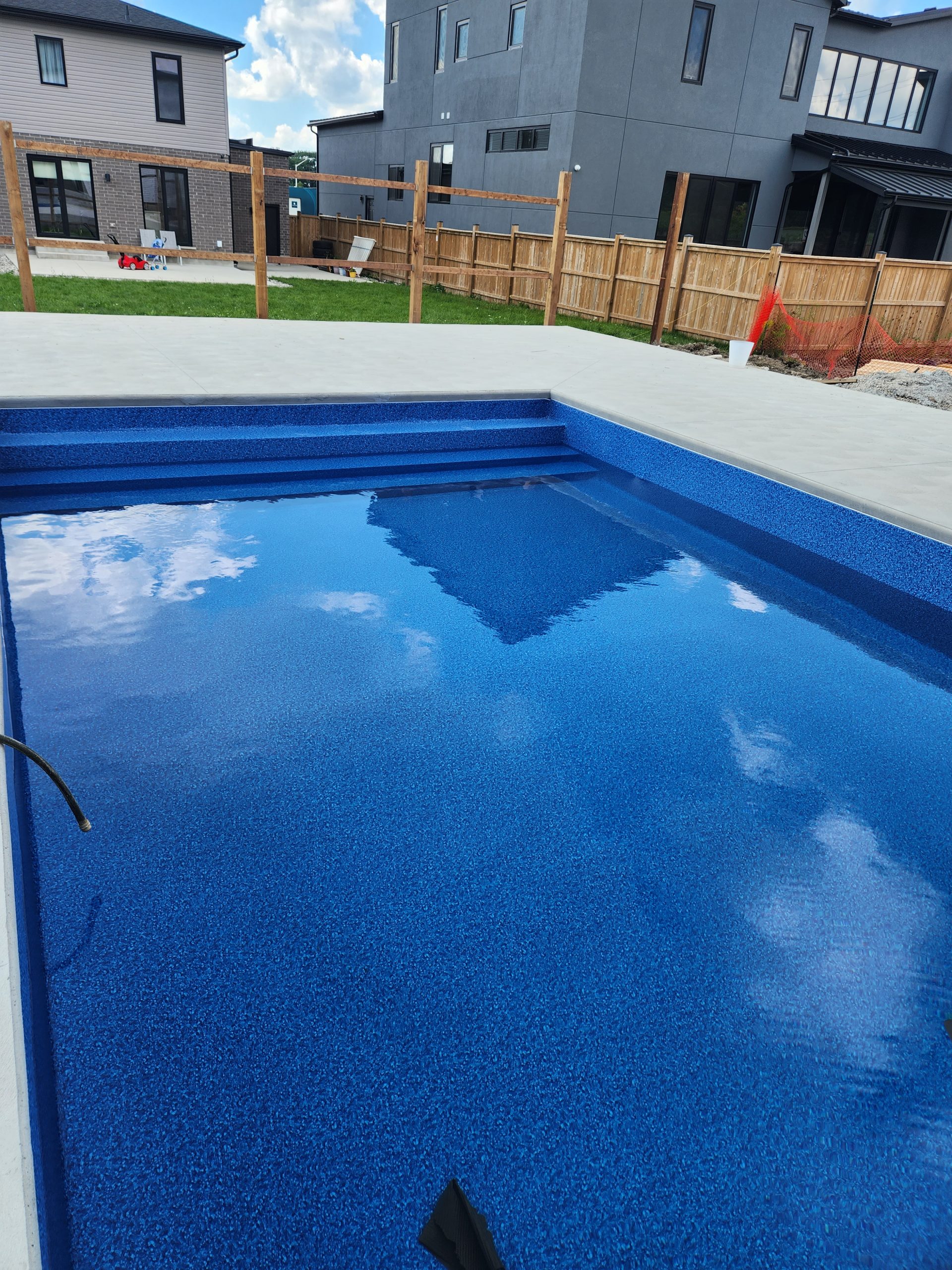 newly installed pool filling with water