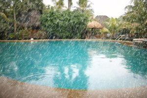 rain weather drops / wet weather concept, pool after heavy rain